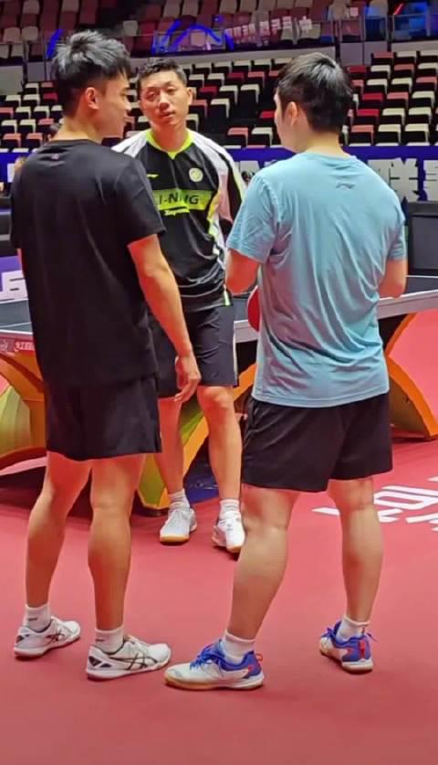 Fan Zhendong and Wang Chuqin Share a Joyful High-Five During Training